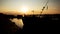 Beautiful Golden Sunset with Ships and Bridge Silhouettes At The River Danube