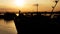 Beautiful Golden Sunset with Ships and Bridge Silhouettes At The River Danube