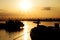 Beautiful Golden Sunset with Ships and Bridge Silhouettes At The River Danube