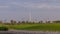 Beautiful golf course during sunrise around modern skyscrapers of Dubai Downtown timelapse in luxury Dubai city, United