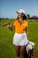 Beautiful golf player in skirt