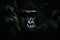 Beautiful gorilla peeking through leaves in the rainforest. Generative AI