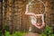 Beautiful and graceful aerial gymnast does exercises on the ring