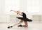 Beautiful graceful ballerina in black swan dress