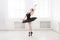 Beautiful graceful ballerina in black swan dress