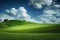 Beautiful grassy field nature landscape background panorama with blooming glade, trees, hills and wonderful blue sky, generative