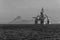 Beautiful grayscale landscape shot of an oil extraction platform