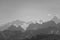 Beautiful grayscale shot of snowy mountain peaks