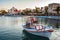 Beautiful greek fishing boat staing parked at harbour of Sitia town on Crete island, Greece