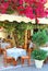 Beautiful greek taverna with bougainvillea flowers