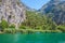 Beautiful green canyon of the river Cetina with rocks, stones and reflection in a water, summer landscape, Omis