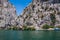 Beautiful green canyon of the river Cetina with rocks, stones and reflection in a water, summer landscape, Omis