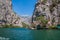 Beautiful green canyon of the river Cetina with rocks, stones and reflection in a water, summer landscape, Omis