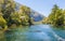 Beautiful green canyon of the river Cetina with rocks, stones and reflection in a water, summer landscape, Omis