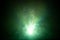 Beautiful green color light beam at night . smoke texture spotlight . screening abstract background .