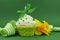 Beautiful green decorated cupcake with daffodil and stripe ribbon