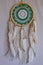 Beautiful green dream catcher on white background