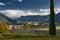 Beautiful green landscape of the Dorf Tirol in warm sunlight with hills in the background