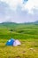 Beautiful green mountain landscape with camping tent in Lago-Naki