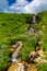 Beautiful green mountain landscape with waterfall in Lago-Naki