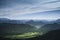 Beautiful green mountainous landscape with hills under a cloudy sky