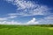 Beautiful green paddy terraces under bright blue sky with clowds