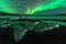 A beautiful green and red aurora dancing over the Jokulsarlon la