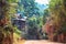 Beautiful green road walkway to the Viewpoint from Kep National Park, Cambodia. Cambodian village, typical rural house building