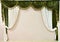 Beautiful green white velvet curtain on beige wall