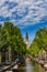 Beautiful Groenburgwal canal in with the Soutern church  Zuiderkerk at the end in Amsterdam, Netherlands