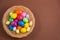 Beautiful group Easter eggs in the spring of easter day, red eggs, blue, purple and yellow in Wooden basket on the brown