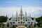 Beautiful group of white pagoda, Thutangkachedi, stupa with multiple spires of Wat Asokaram on sunny day