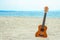 Beautiful guitar on the sand by the Greek sea