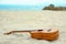 Beautiful guitar on the sand by the Greek sea