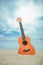 Beautiful guitar on the sand by the Greek sea