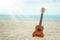 A beautiful guitar on the sand by the Greek sea