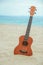 A beautiful guitar on the sand by the Greek sea