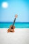 A beautiful guitar on the sand by the Greek sea