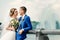 Beautiful guy and girl, bride in a white wedding dress, groom in a classic blue suit against a nature background. Wedding, family