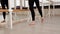 Beautiful gymnast does the splits in a room with ballet lathe and mirrors