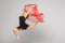 Beautiful gymnastics dancer on aerial silk in studio on white background.