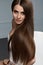 Beautiful Hair Color. Woman With Glossy Straight Brown Long Hair