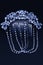 A beautiful hair comb of white stones on the dark blue background