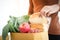 Beautiful hand woman Grab the bread from the brown paper bag.