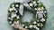 Beautiful, handmade Christmas wreath made with wooden decorations, balls, stars and bow