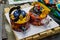 Beautiful handmade decorative traditional Indian kettles are displayed in a shop for sale in blurred background. Indian handicraft