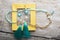 Beautiful handmade  turquoise  jewelry with natural gems in yellow box around old style wooden background. close up. fashion