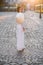 Beautiful happy asian girl dressed in national traditional Ao Dai dress with vietnamese conical hat Non La, Leaf Hat.