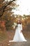 beautiful happy bride holding wedding autumn bouquet