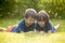 Beautiful happy children, boy brothers, exploring nature with ma